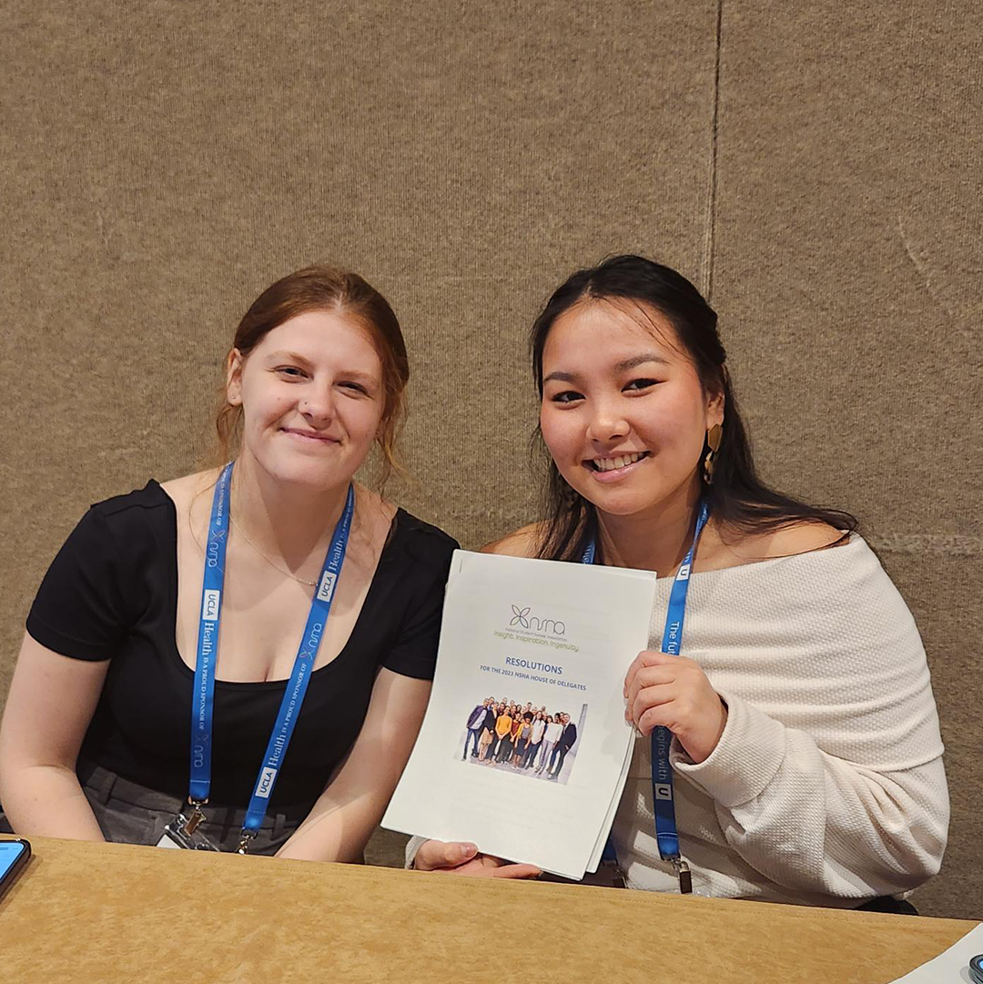 Sara McCarthy (pictured right) with accepted resolution for NSNA 2023 